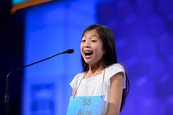 Alia Abiad preparing to spell a word at the microphone during the National Spelling Bee