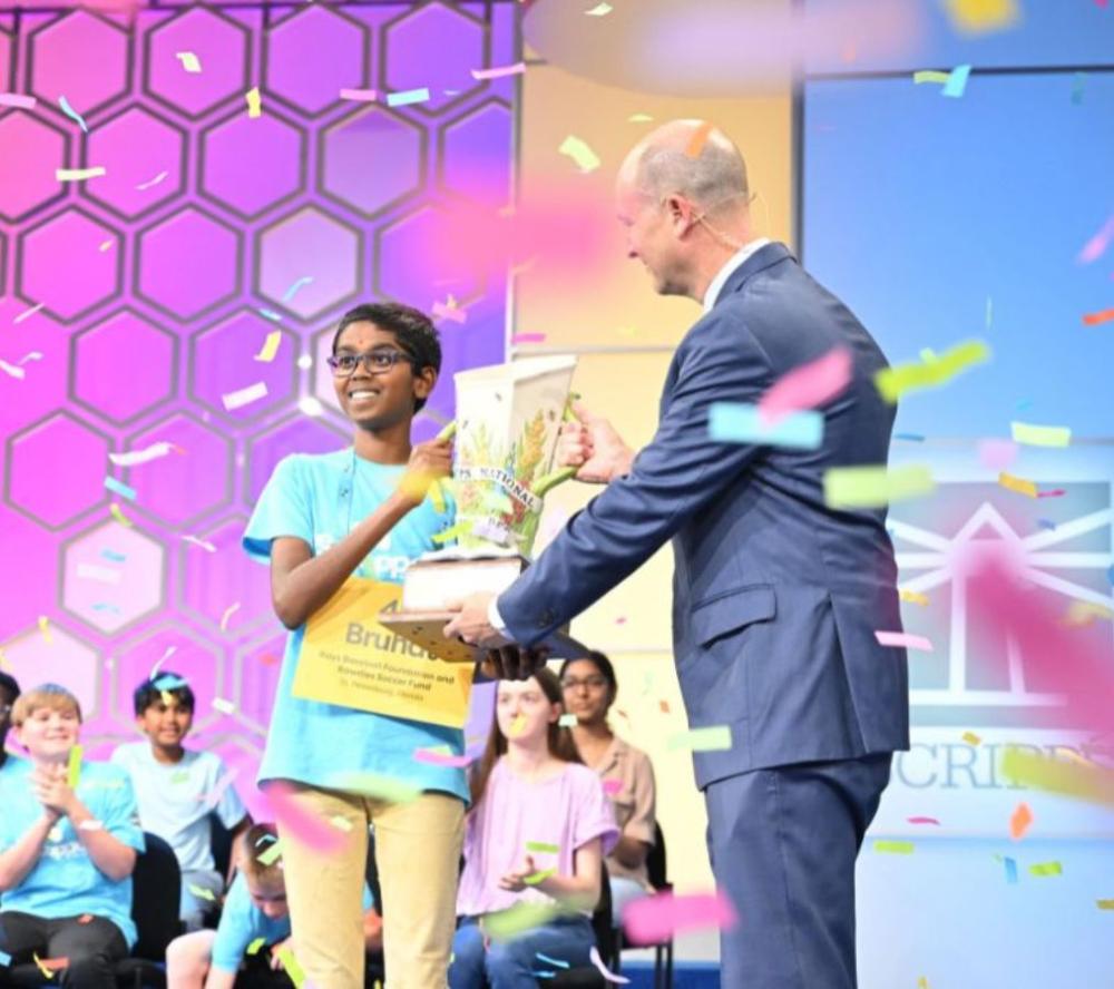 2024 Scripps National Spelling Bee Champion Bruhat Soma with Adam Symson, President & CEO of The E.W. Scripps Company